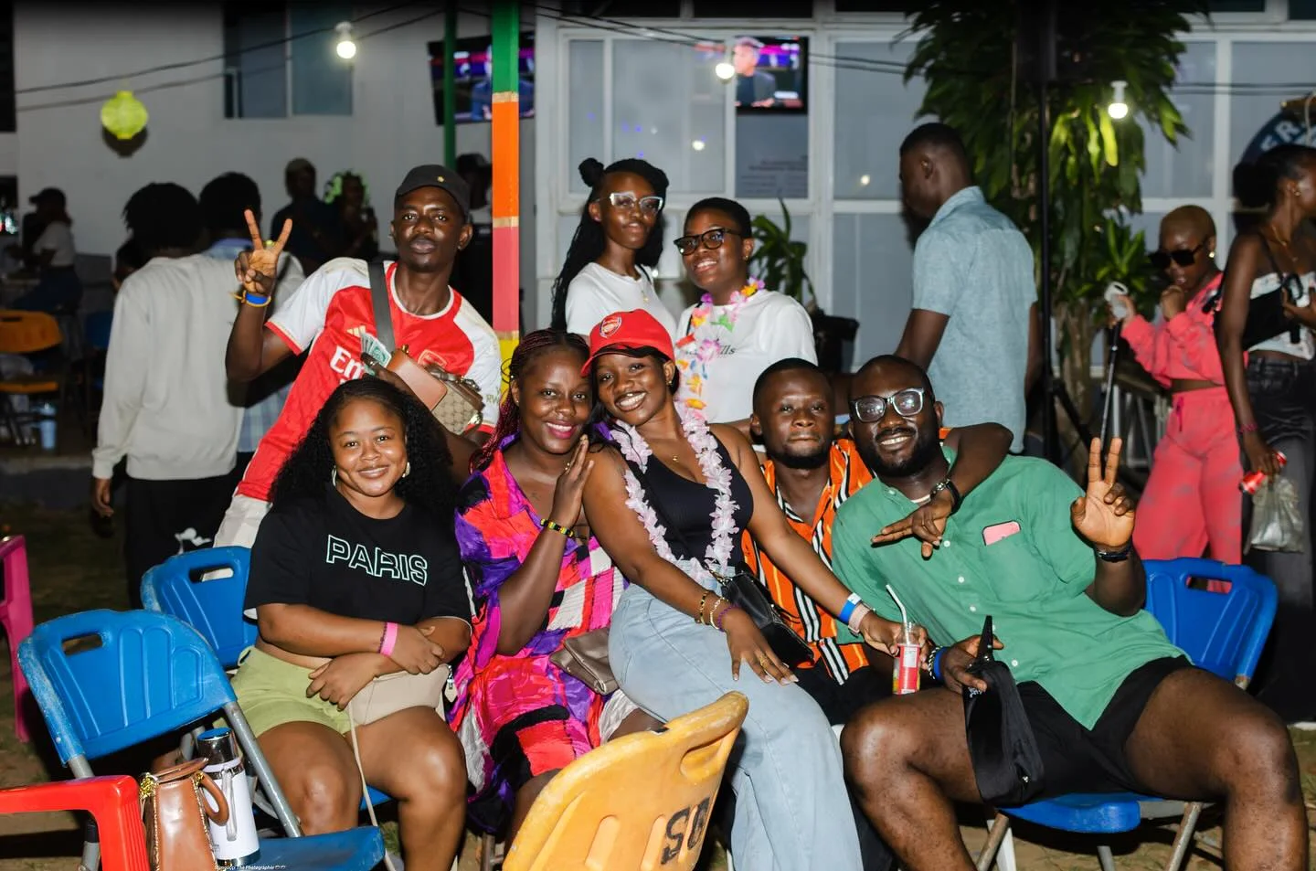 A big group of friends laughing and posing together at The Hangawt